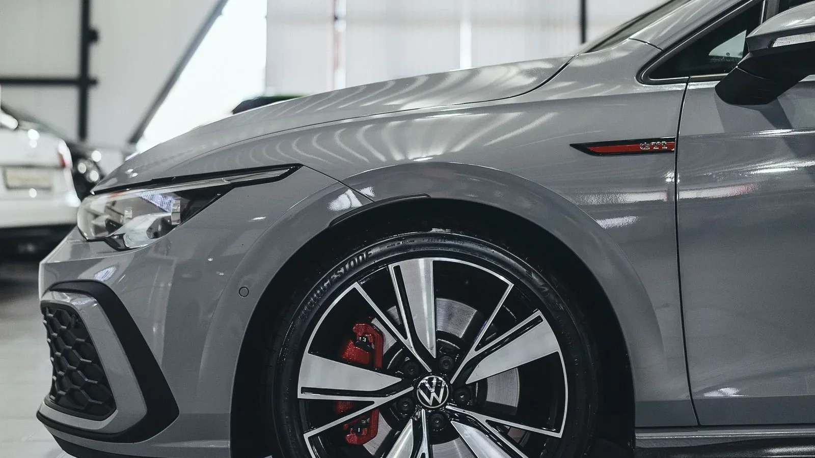 A polished performance vehicle displayed in a professional showroom