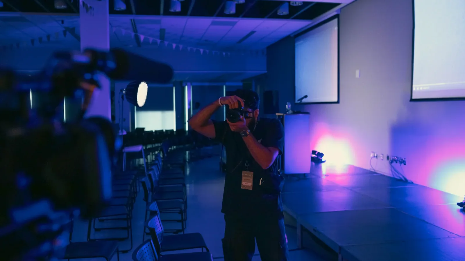 A CK camera operator covering a live professional event