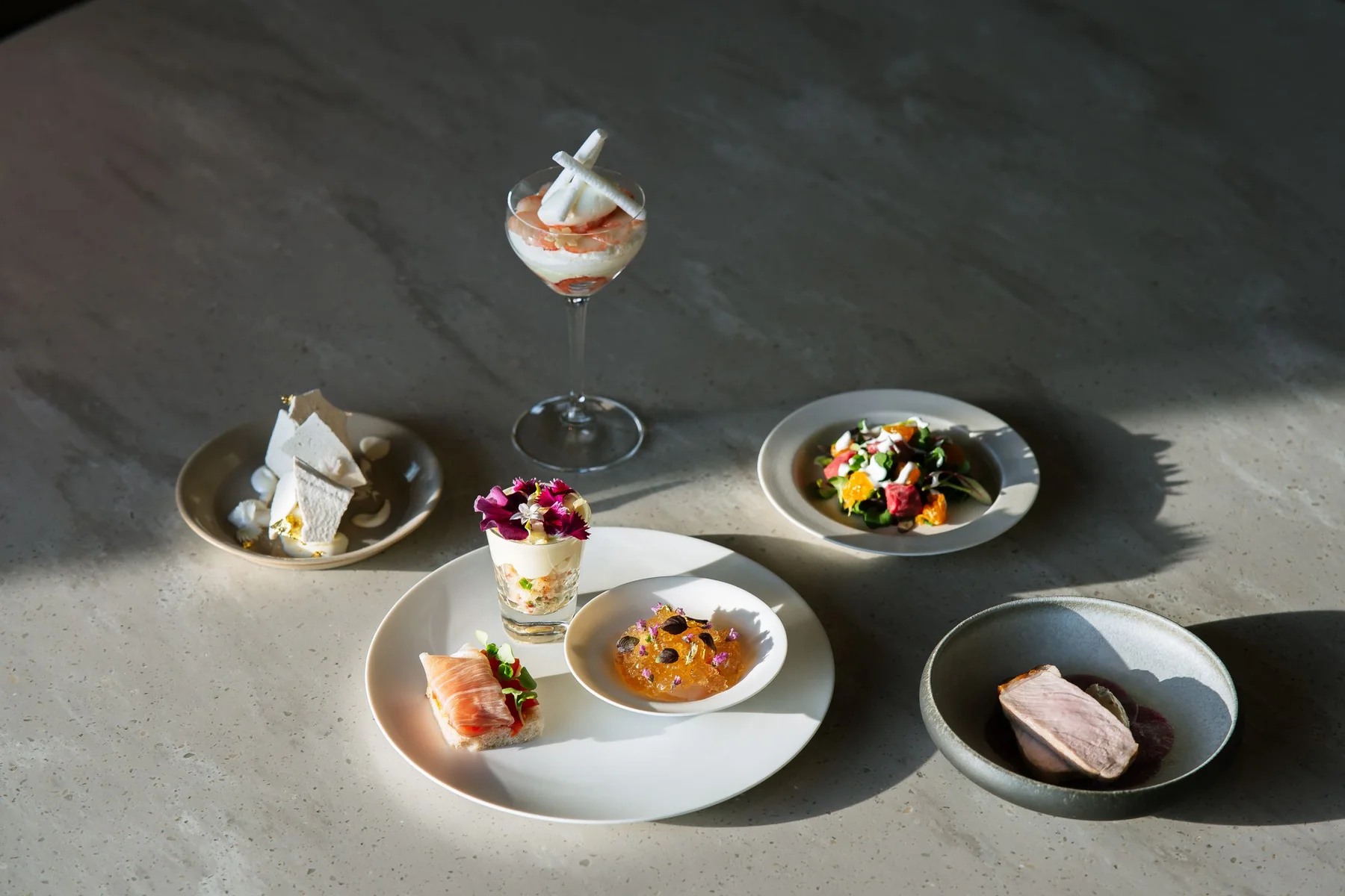 A professionally styled selection of finished restaurant dishes